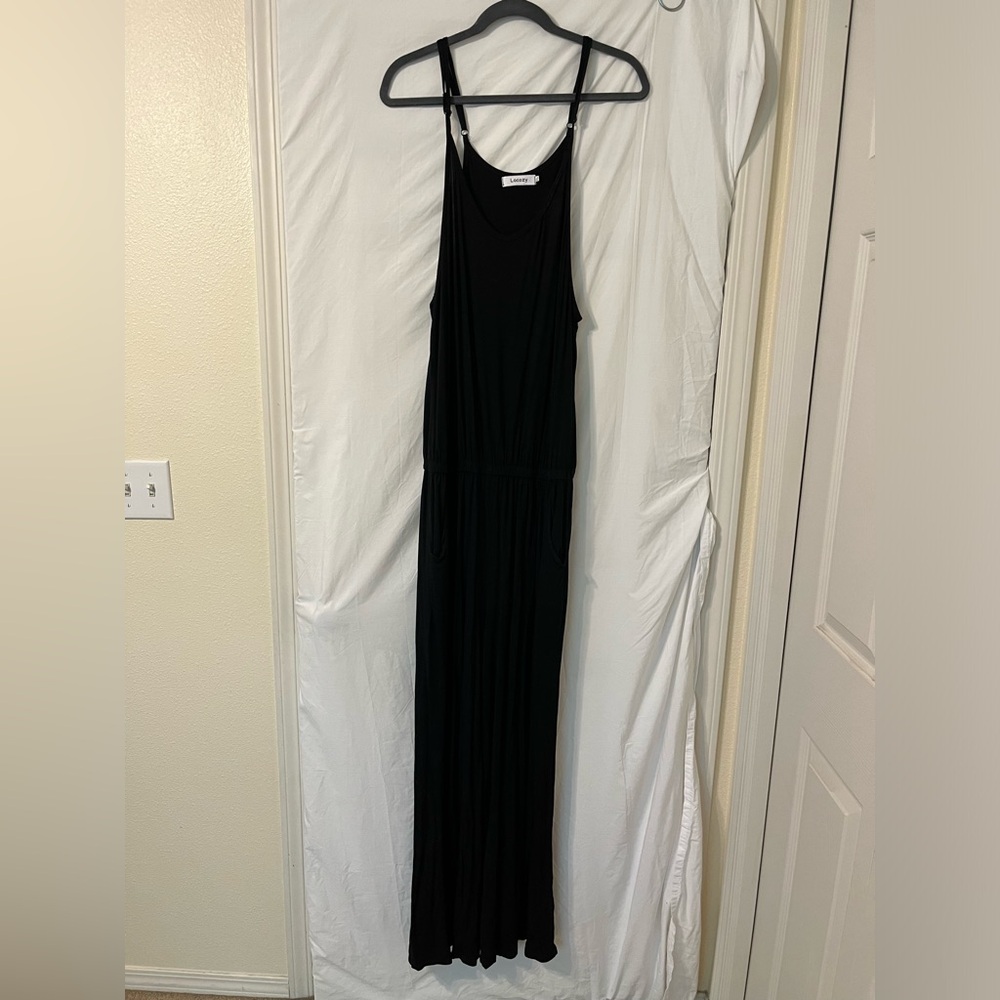 Lacozy black wide leg jump suit with pockets. Adjustable straps